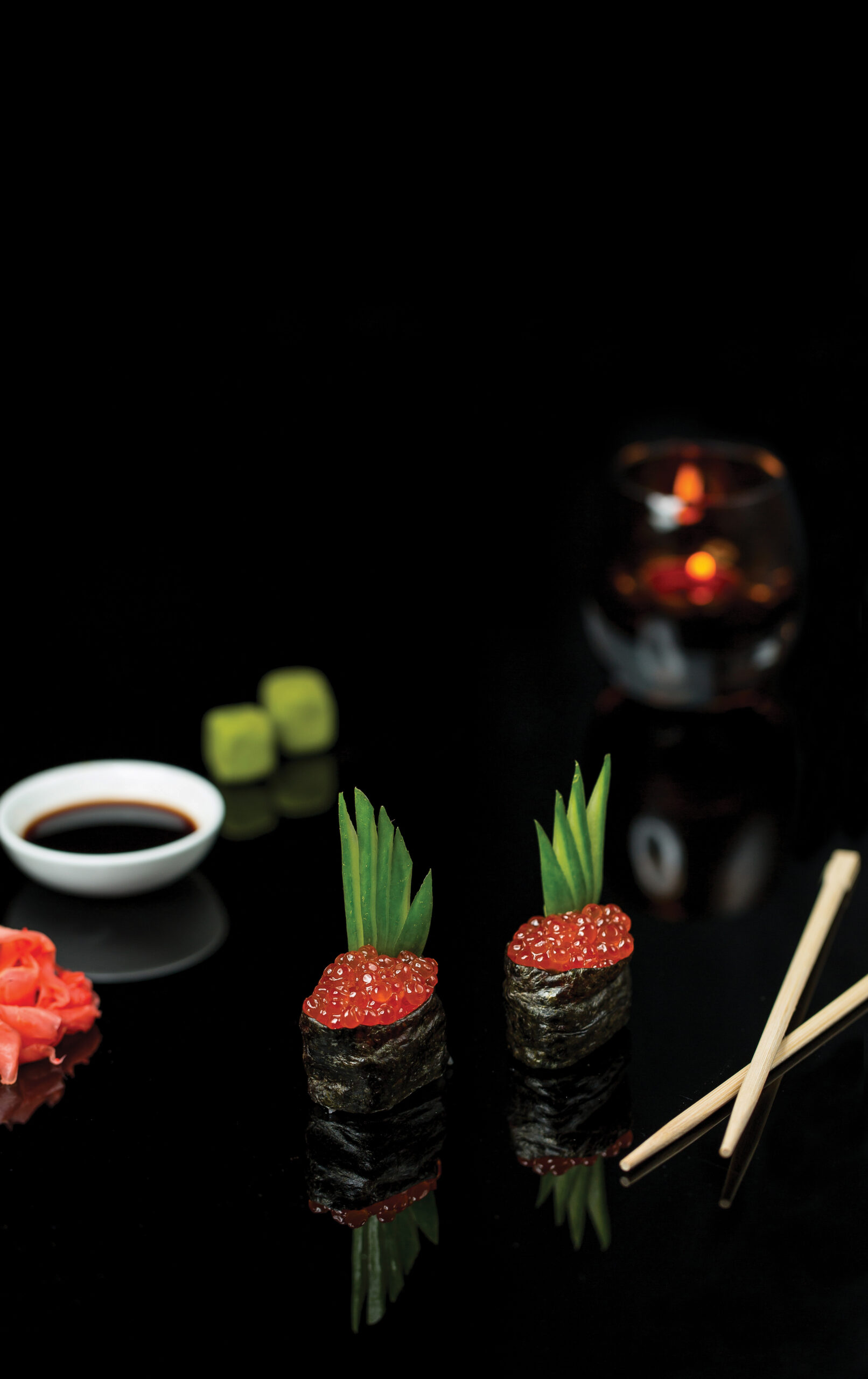 sushi rolls with red salmon caviar sauce